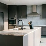"Bright modern kitchen remodel featuring sleek custom cabinetry, a spacious marble kitchen island, and premium stainless steel appliances."