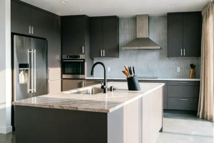 "Bright modern kitchen remodel featuring sleek custom cabinetry, a spacious marble kitchen island, and premium stainless steel appliances."