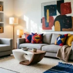 A bright, stylish living room combining minimalist furniture with colorful celebrity-inspired accents, bold wall art, and warm lighting.
