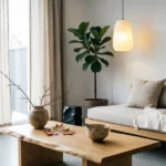 Serene Japandi living room featuring a low wooden daybed, live-edge coffee table, and natural materials like linen and handmade ceramics.